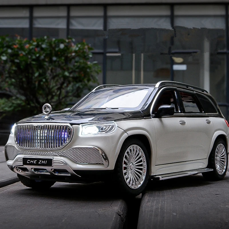 Luxury SUV with visible brand logo on a city street, diecast 1:24 larp maybach GLS 600 model car.